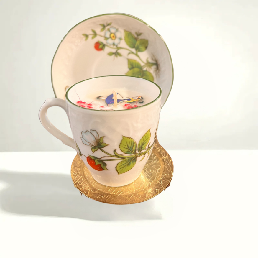 Small Schumann Arzberg Bavaria teacup and saucer with delicate floral detailing and fine white porcelain, made in mid-century Germany.