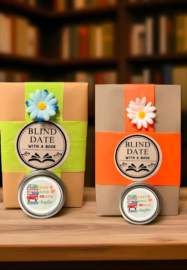 Three 'Blind Date with a Book' packages with flower decorations on a wooden surface with bookshelf background.