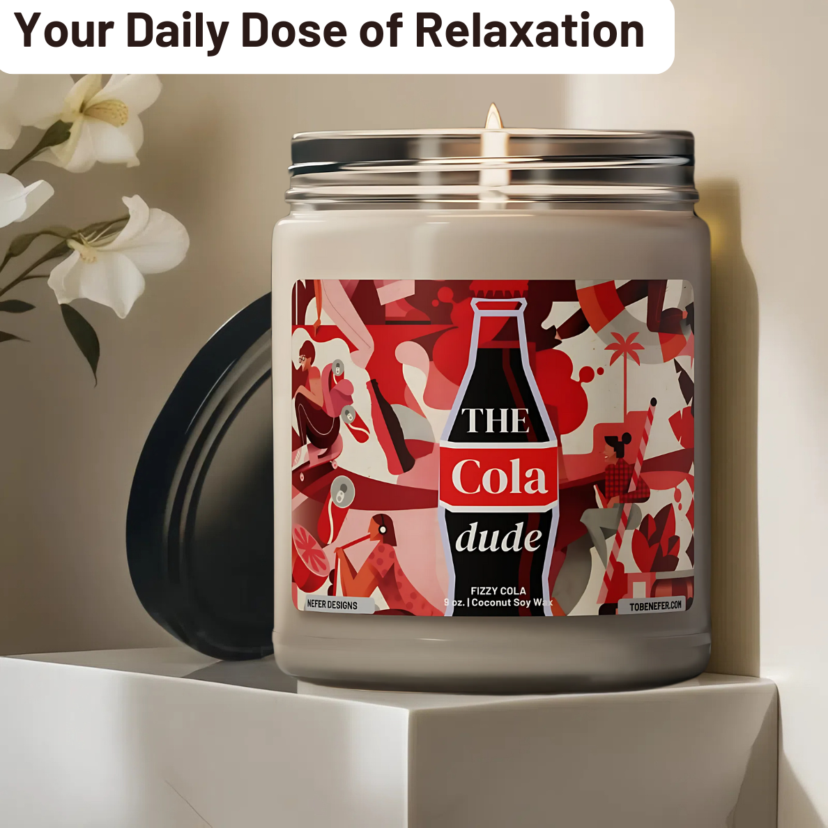 A 9oz Cola Dude Soda Pop Soy Candle in a jar, featuring a bold red design. Hand-poured with a coconut and soy wax blend, it fills the air with the nostalgic scent of classic cola. A fun gift for soda lovers and vintage fans.