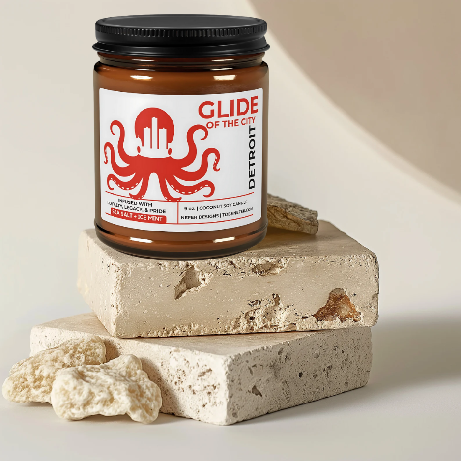 Candle jar labeled 'Glide of the City' on a textured stone surface with a neutral background