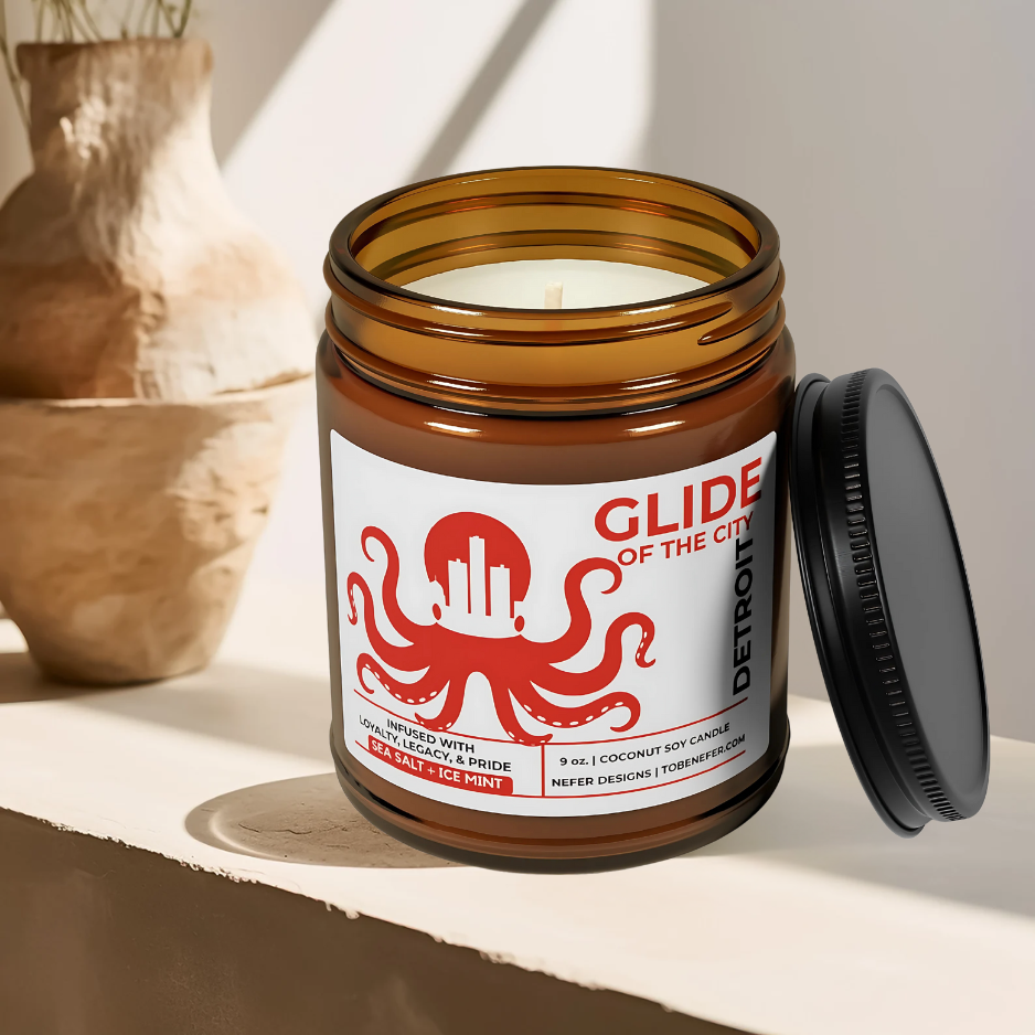 Candle jar with 'Glide of the City' label on a light surface