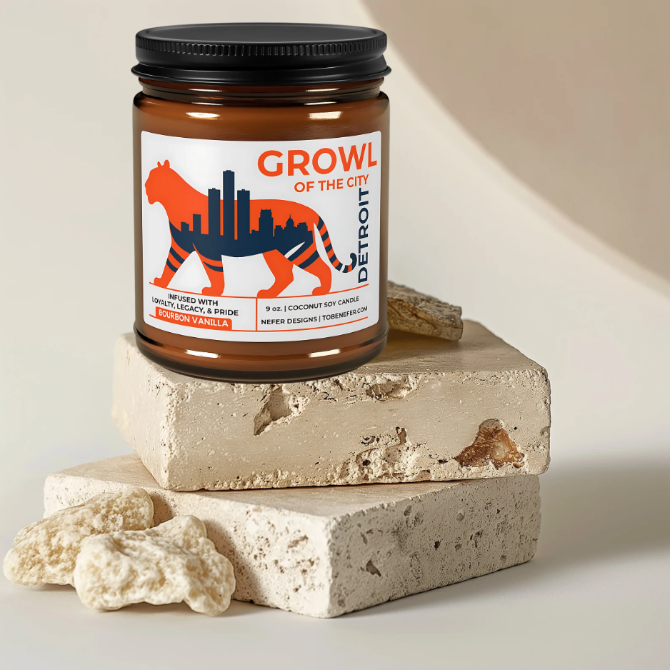 Candle jar with 'Growl of the City' label on a stone surface