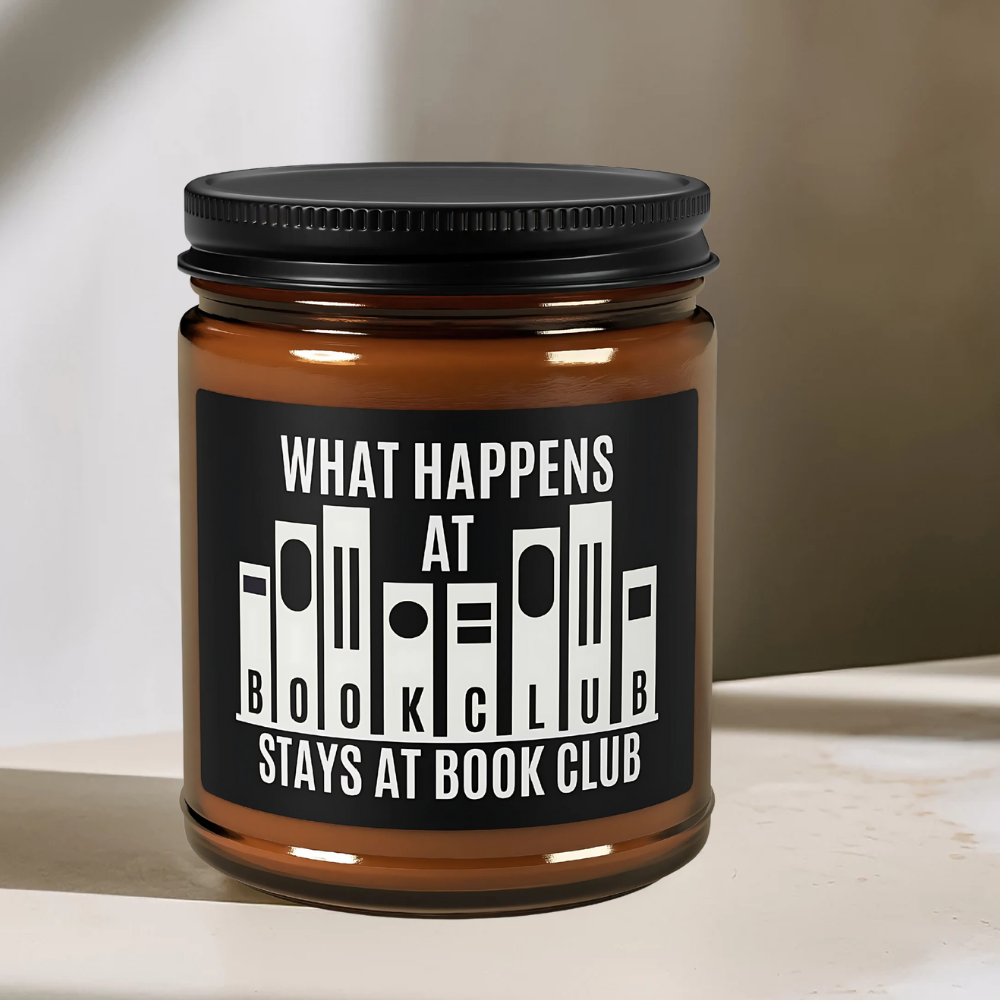Playful exaggerated text on ‘What Happens at Book Club’ candle - a humorous, collectible item for book lovers.