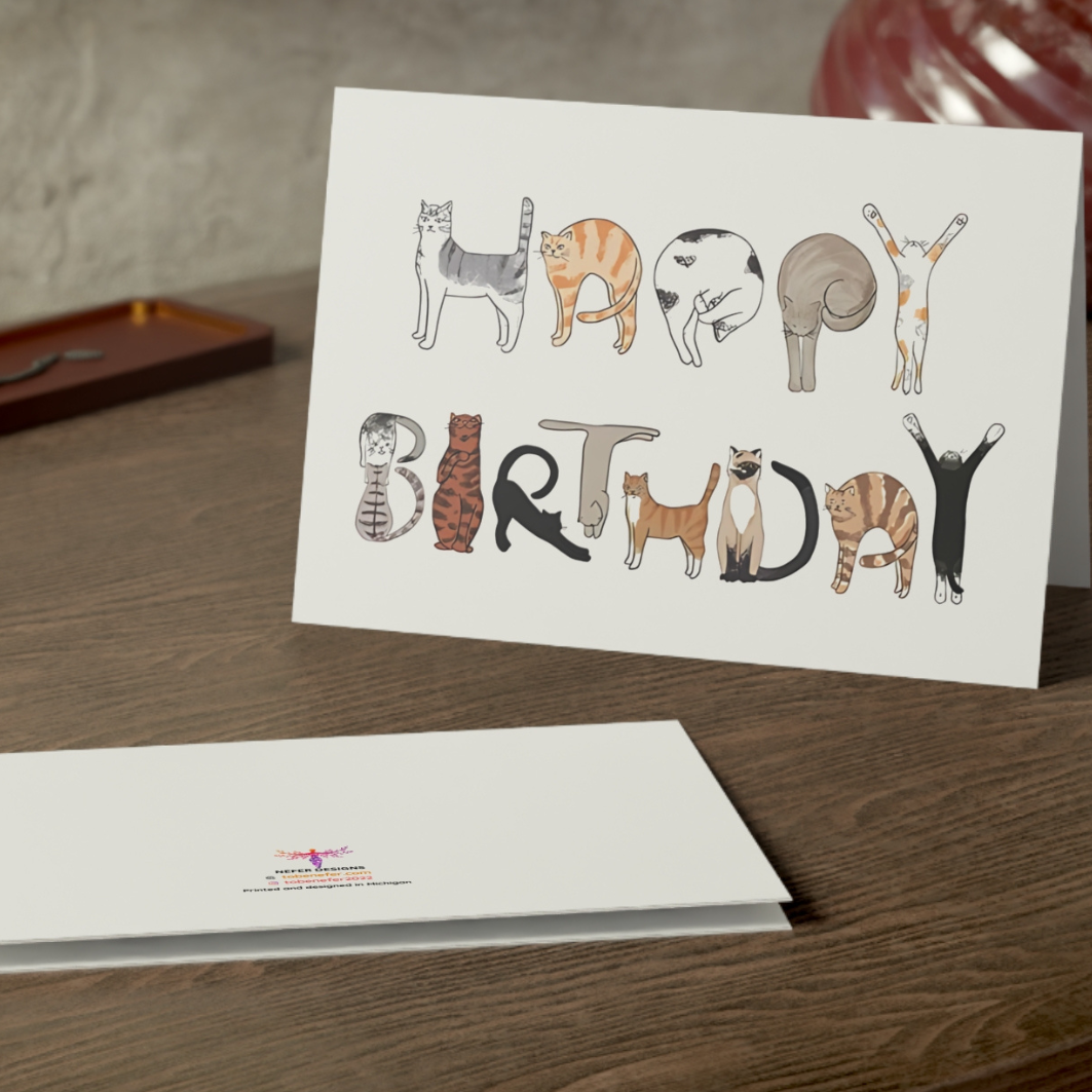 Birthday card with animal illustrations on a wooden surface
