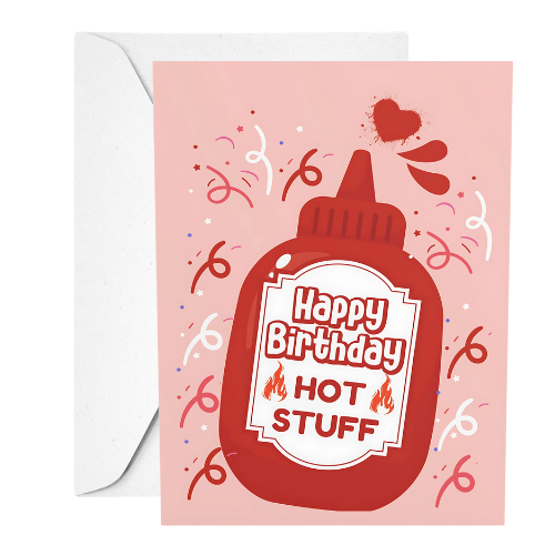 Greeting card with a ketchup bottle design and 'Happy Birthday Hot Stuff' text on a pink background.