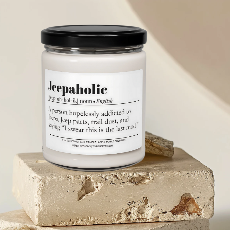 "Hand-poured Jeepaholic candle in a minimalist amber glass jar with a clean cotton wick, sitting on rock surface.