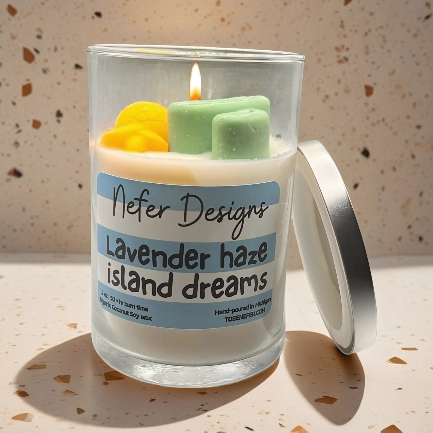 A hand-poured Lavender Haze & Island Dreams soy candle in an elegant jar, evoking a tranquil escape with soothing lavender and refreshing ocean breeze scents.