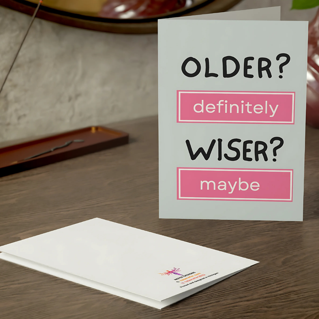 Greeting card with humorous text on a table
