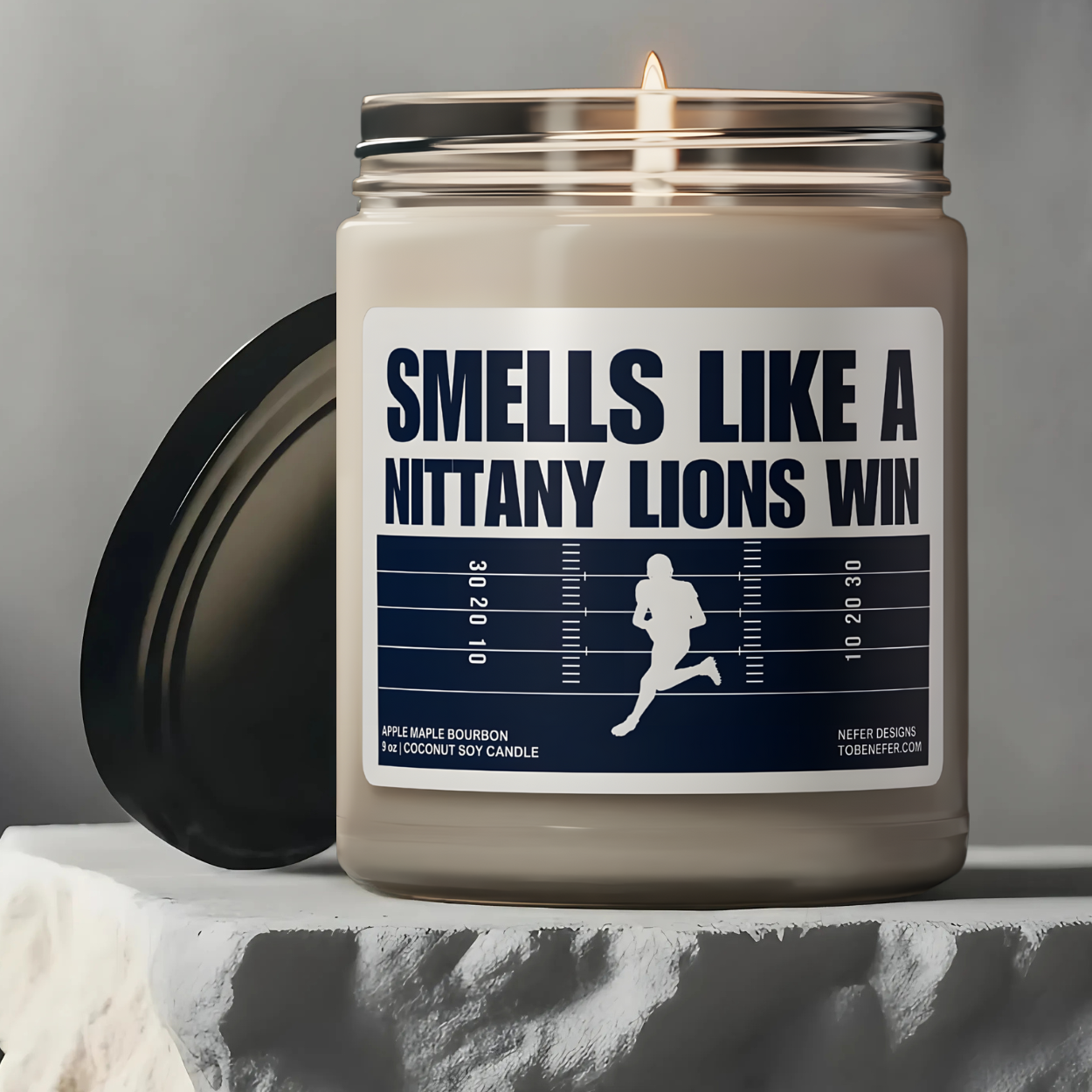 The Pennsylvania State University Nittany Lions Football Game day candle with the label showing the team colors