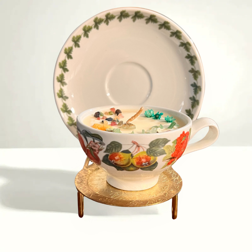Portmeirion Pomona teacup and saucer with hand-painted fruit motifs in vibrant colors, made in England in the 1970s.
