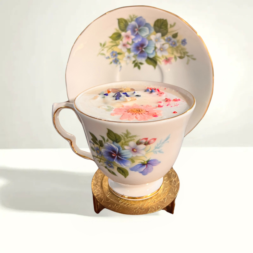 Queen Anne 8609 teacup and saucer with soft pastel floral motifs, a mid-century English porcelain set known for its delicate craftsmanship