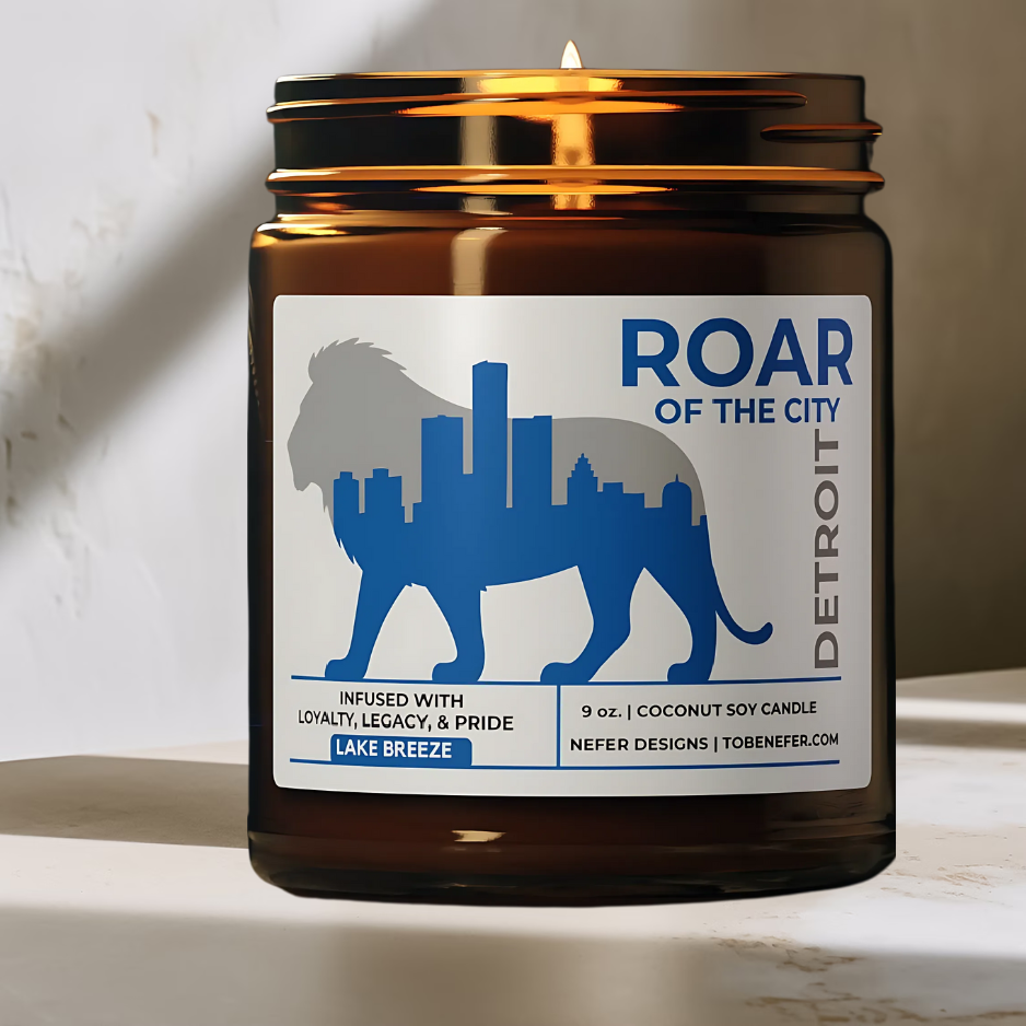 Candle in a brown jar with a 'Roar of the City Detroit' label on a light background