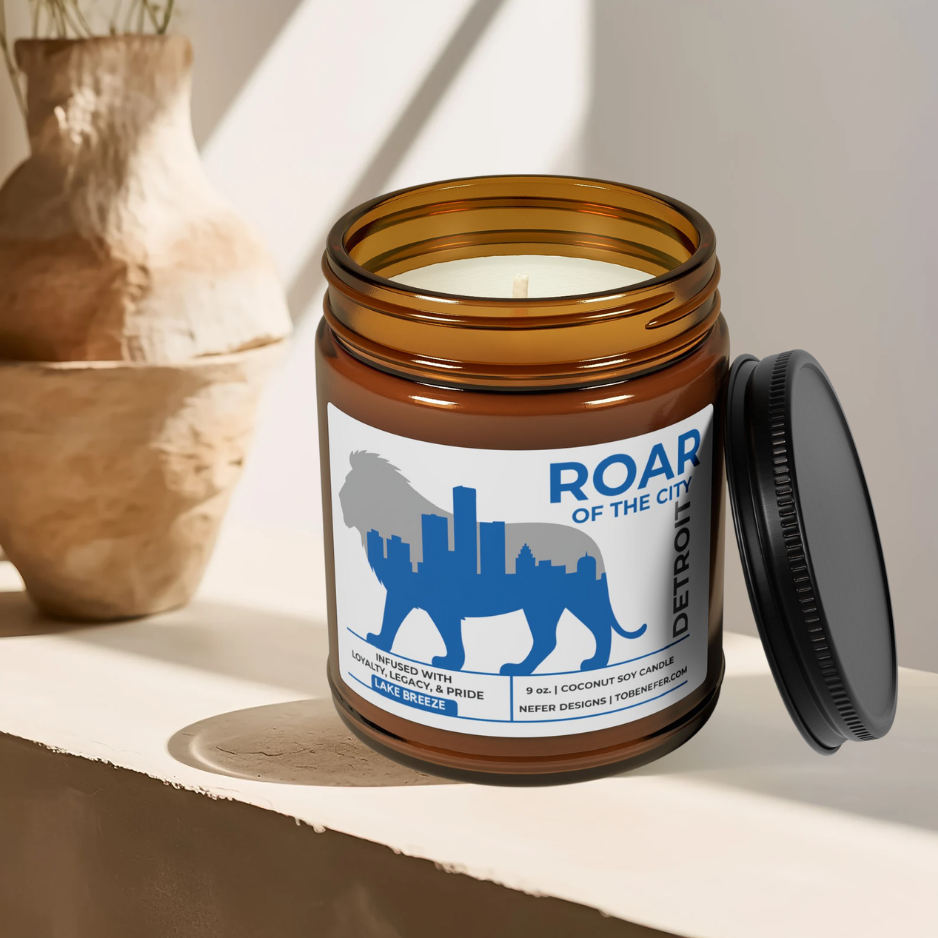 Candle jar with 'Roar of the City' label on a light surface