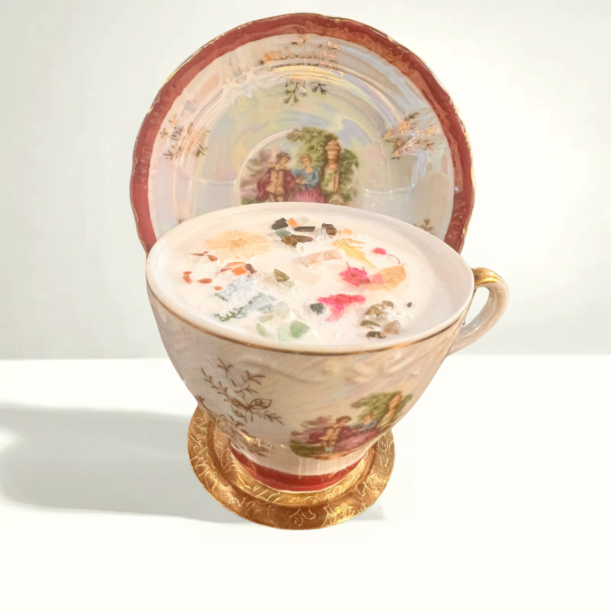Royal Crown Japan porcelain teacup and saucer featuring a romantic scene with a young couple and the royal couple, crafted in 1980