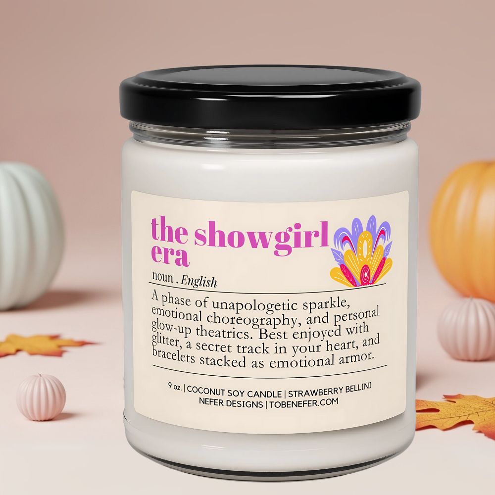 Candle jar with a label titled 'the showgirl era' on a neutral background