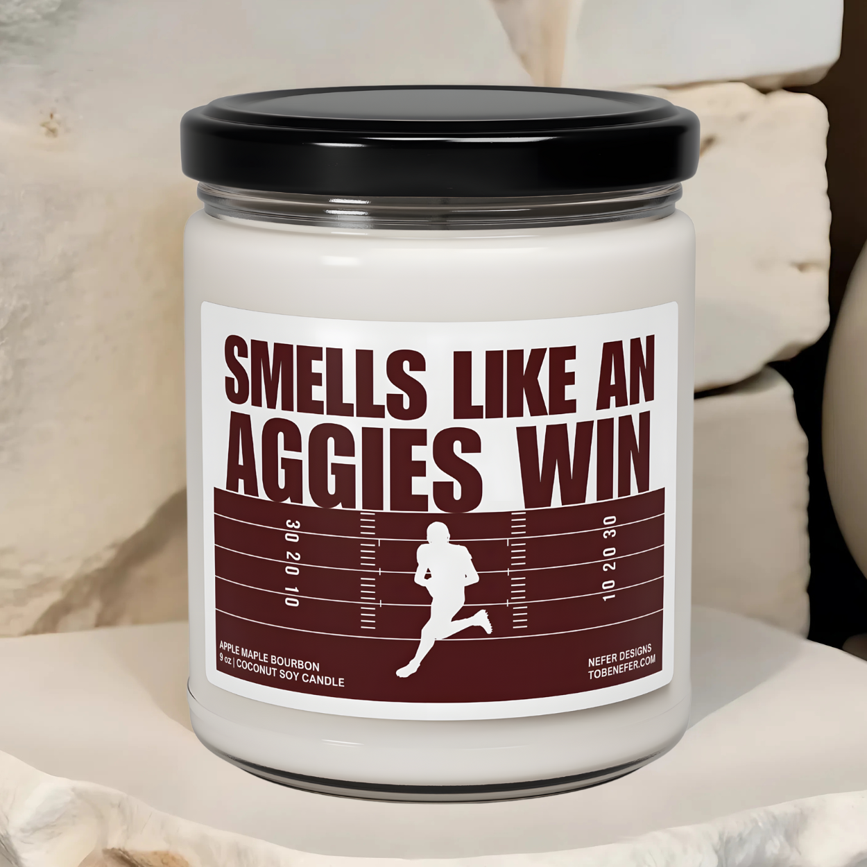 Texas Aggies football game day candle with the colors of the team on the label