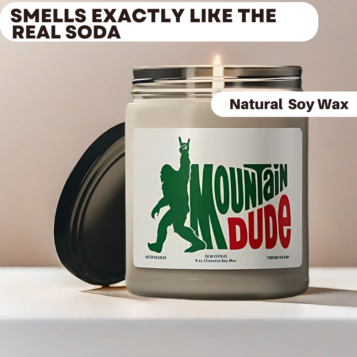A 9 oz Mountain Dude Soda Pop Soy Candle in a jar, featuring a vibrant bigfoot design with the wording of mountain dude. The candle is hand-poured with a coconut and soy wax blend, offering a refreshing lemon-lime soda scent. Perfect for soda lovers and nostalgia enthusiasts.