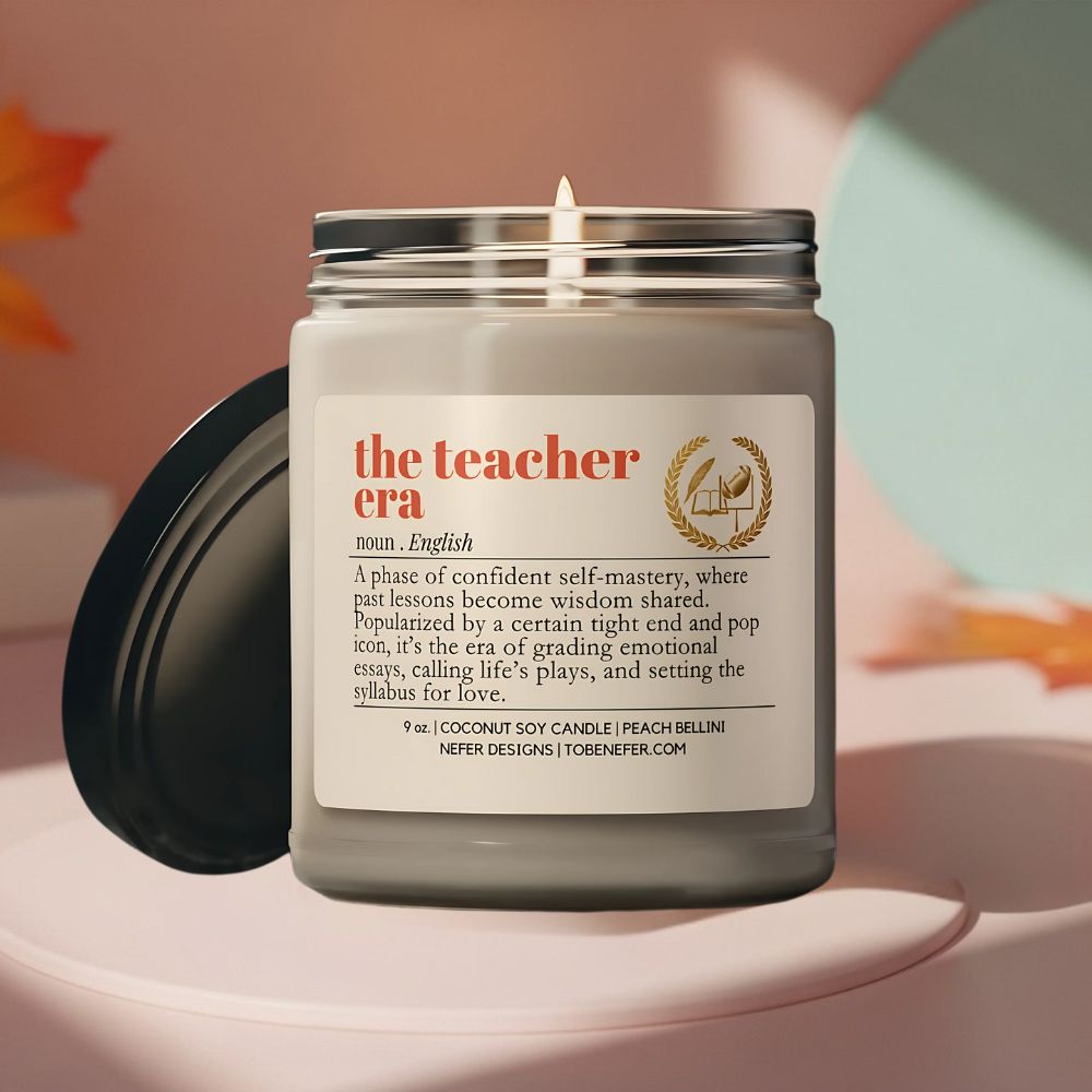 Candle in a jar with a label titled 'the teacher era' on a soft background