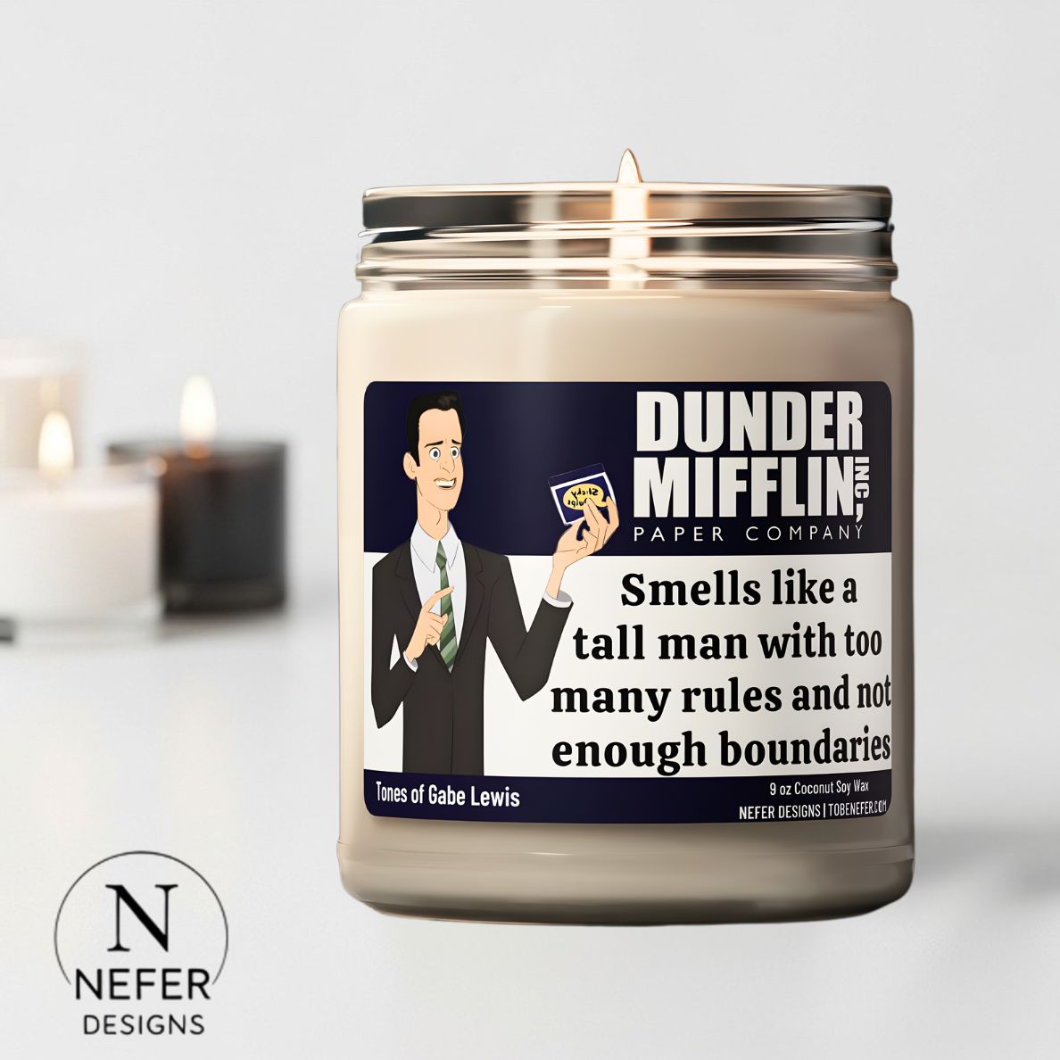 Scented soy candle with a label featuring the Gabe Lewis character from 'The Office' and the brand 'Nefer Designs'.