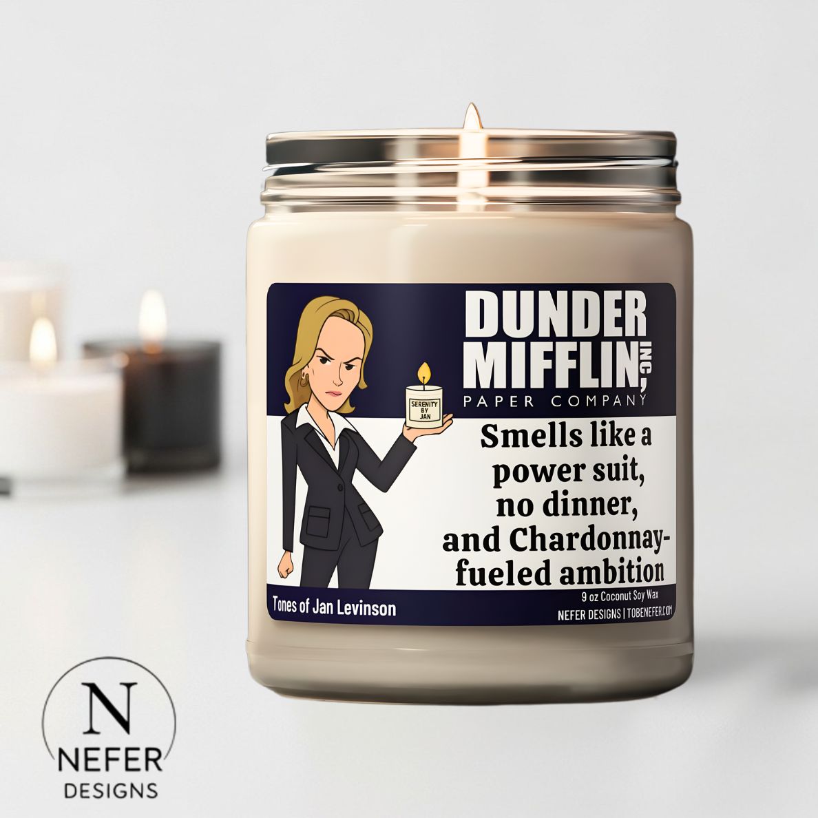 Candle with a label featuring a Jan character from 'The Office' and the brand 'Nefer Designs'.