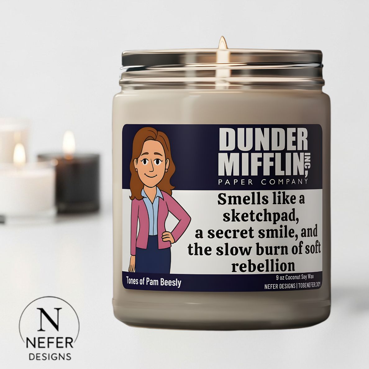 Scented Soy Candle with a label featuring Pam receptionist character from 'The Office' on a light gray background