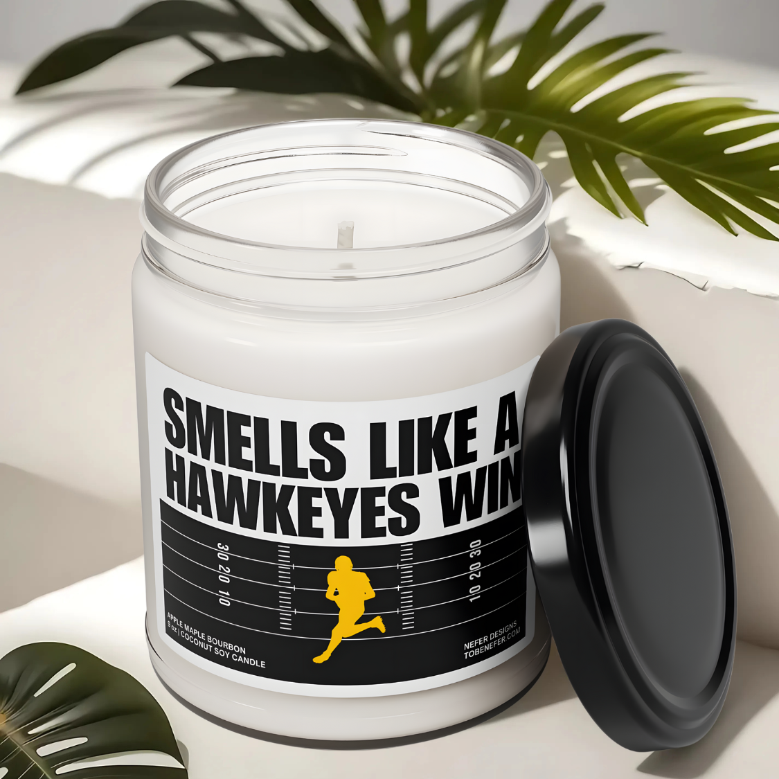 Smells Like a Hawkeyes Win game day candle with the label showing the school colors.