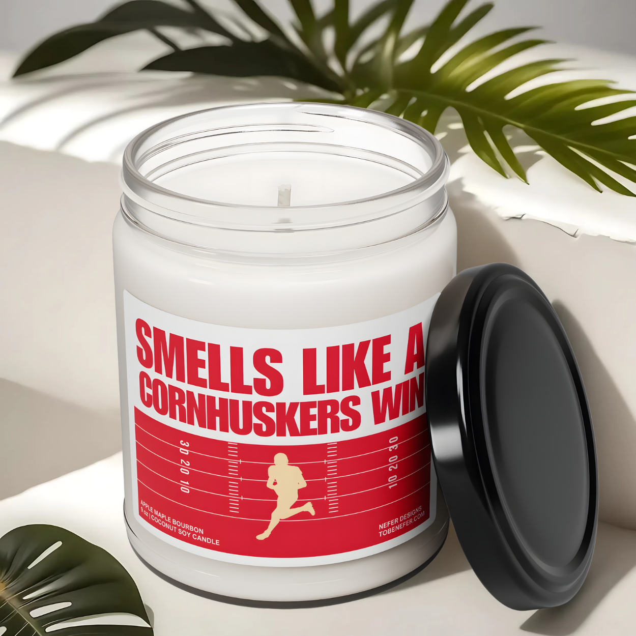 University of Nebraska Cornhuskers Football game day candle wit the team colors on the label