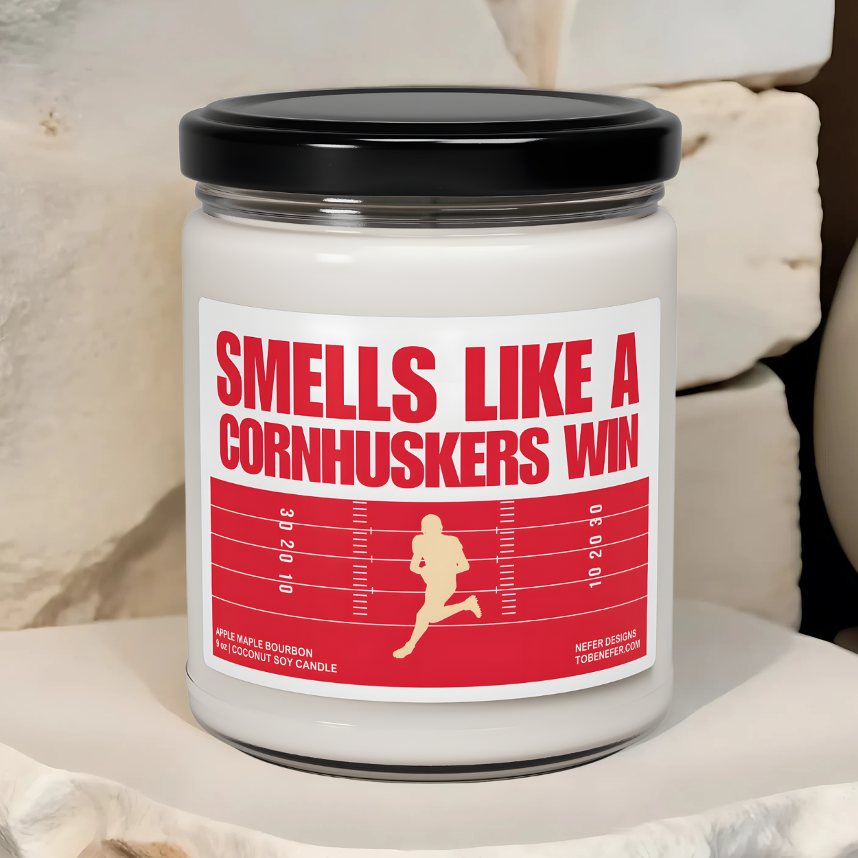 University of Nebraska Cornhuskers Football game day candle wit the team colors on the label