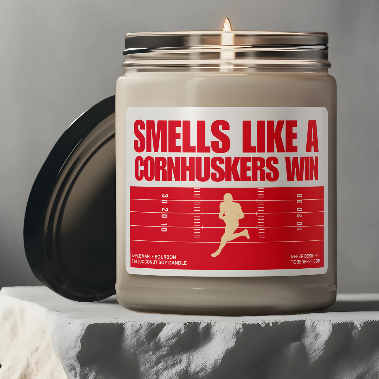 University of Nebraska Cornhuskers Football game day candle wit the team colors on the label