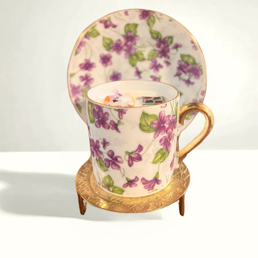 Delicate vintage teacup and saucer with a purple floral pattern, crafted by INARCO in Japan, showcasing elegant mid-century porcelain craftsmanship.