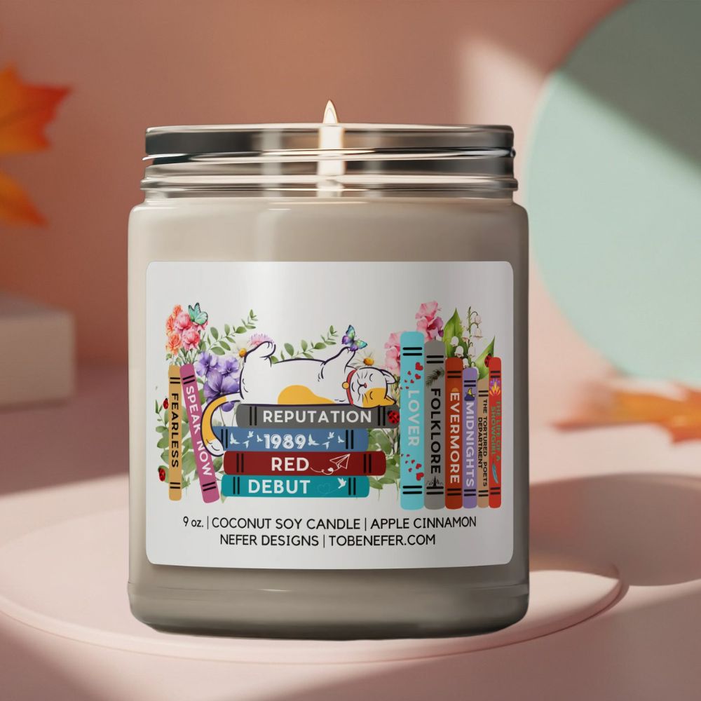 Candle with a colorful label on a light pink background