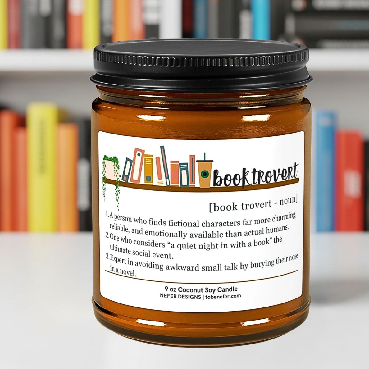 Candle jar with 'book trovert' label on a blurred bookshelf background
