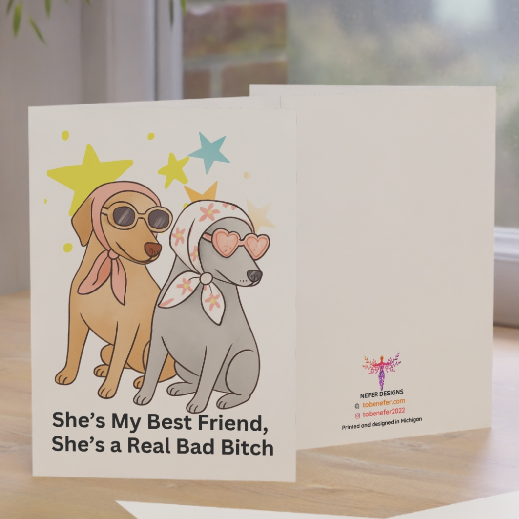 Card with cartoon dogs and humorous text on a wooden surface