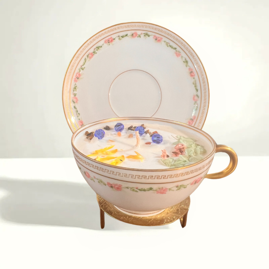 Antique teacup and saucer set from Haviland Limoges, featuring intricate floral designs and gold accents, produced between the late 1800s and early 1900s.