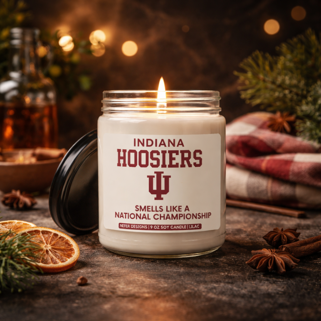 Candle in a jar labeled 'Indiana Hoosiers' with decorative items on a wooden surface.