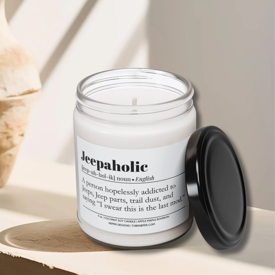 Hand-poured Jeepaholic candle in a minimalist amber glass jar with a clean cotton wick, sitting on a stone surface.