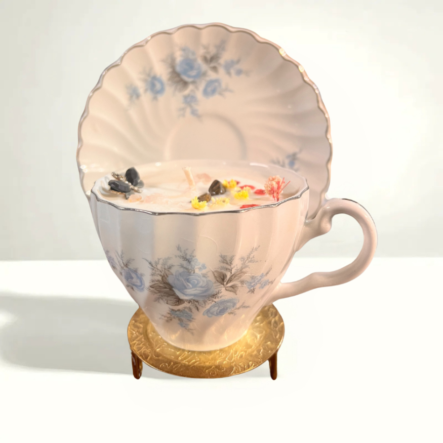 Johnson Bros Blue Rose teacup with delicate blue roses and intricate floral details, crafted in Staffordshire, England, from the mid-20th century.
