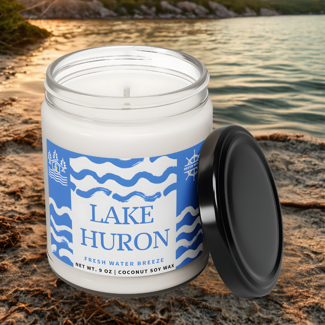 A rustic-style Lake Huron-themed candle with the words 'FRESH WATER BREEZE' and details about its 9-ounce coconut soy wax formula, evoking lakeside serenity.