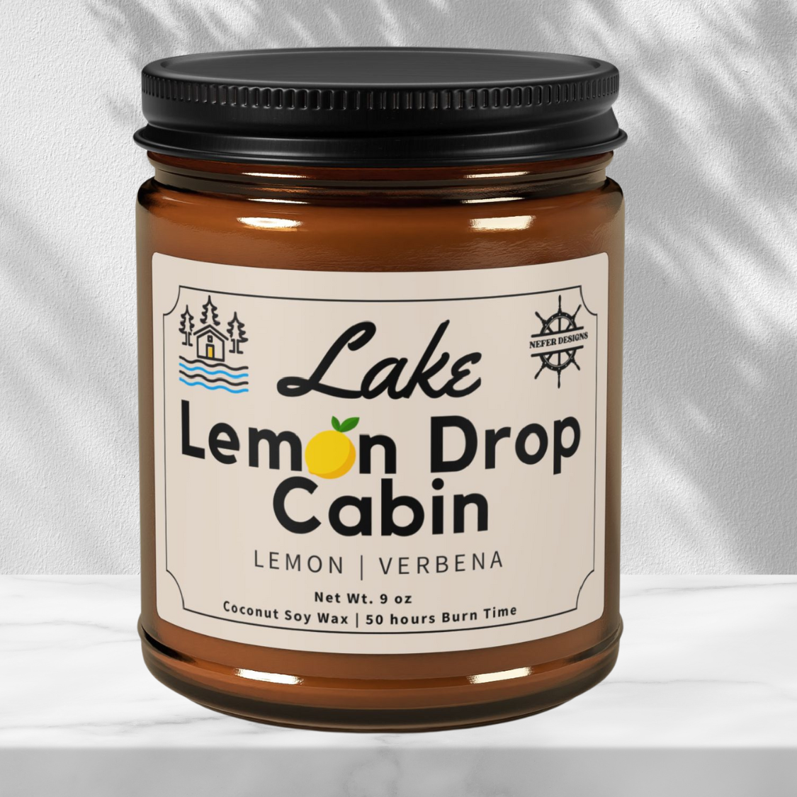 Close-up of Nefer Designs' Lake Lemon Drop candle showing clean-burning coconut soy wax (9oz) with refreshing lemon verbena aroma for cozy spaces.