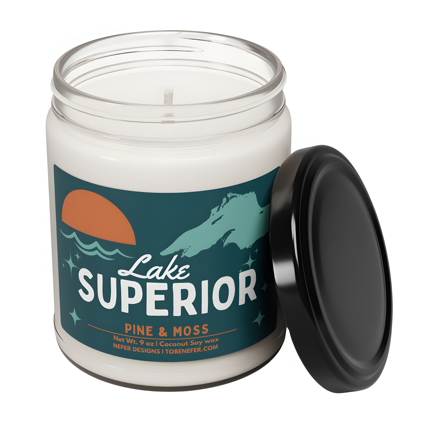 "A candle labeled 'Lake Superior' with the scent 'Pine & Moss.' The label states it is made of coconut soy wax, weighs 9 ounces