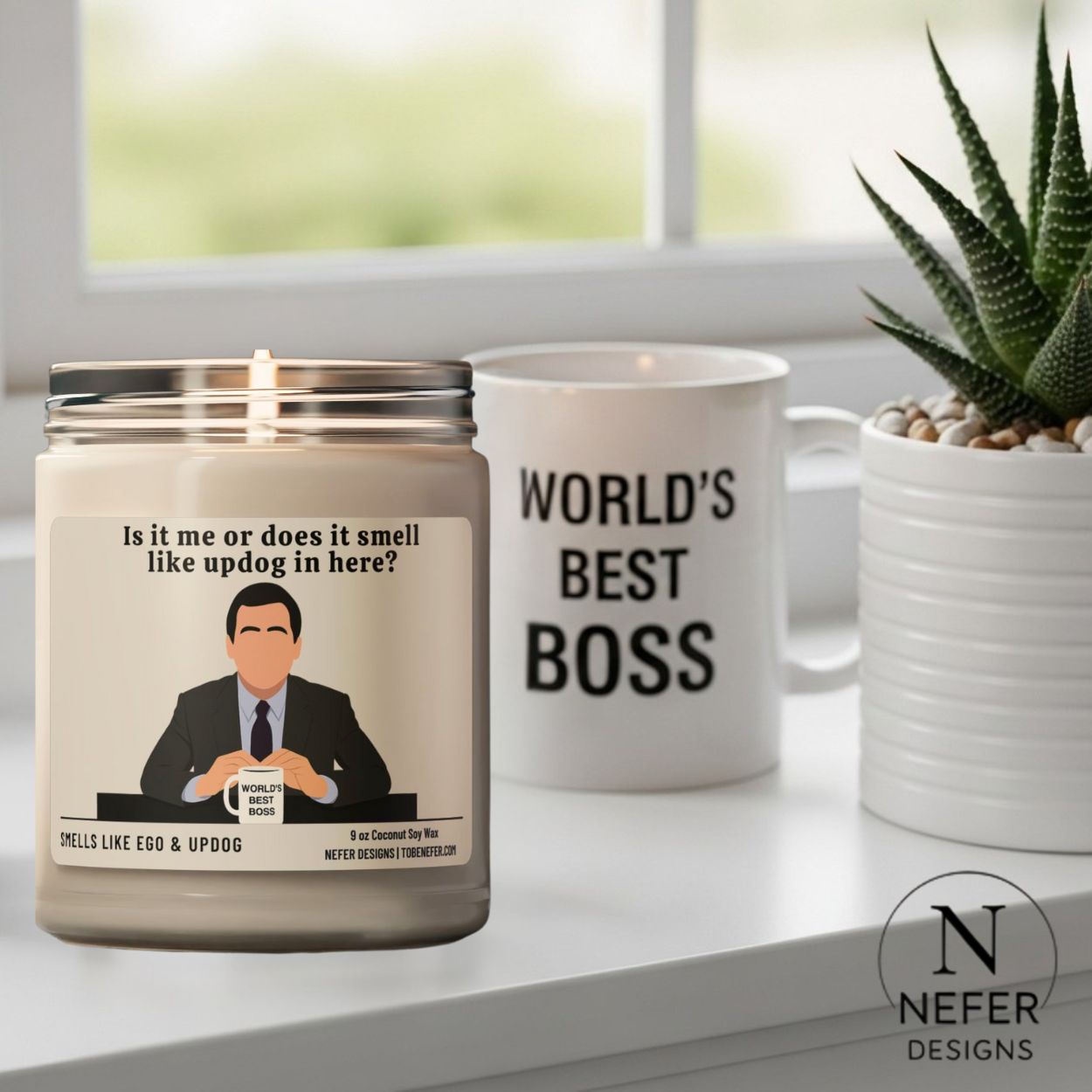 The office show themed candle sitting next to the worlds best boss mug 
