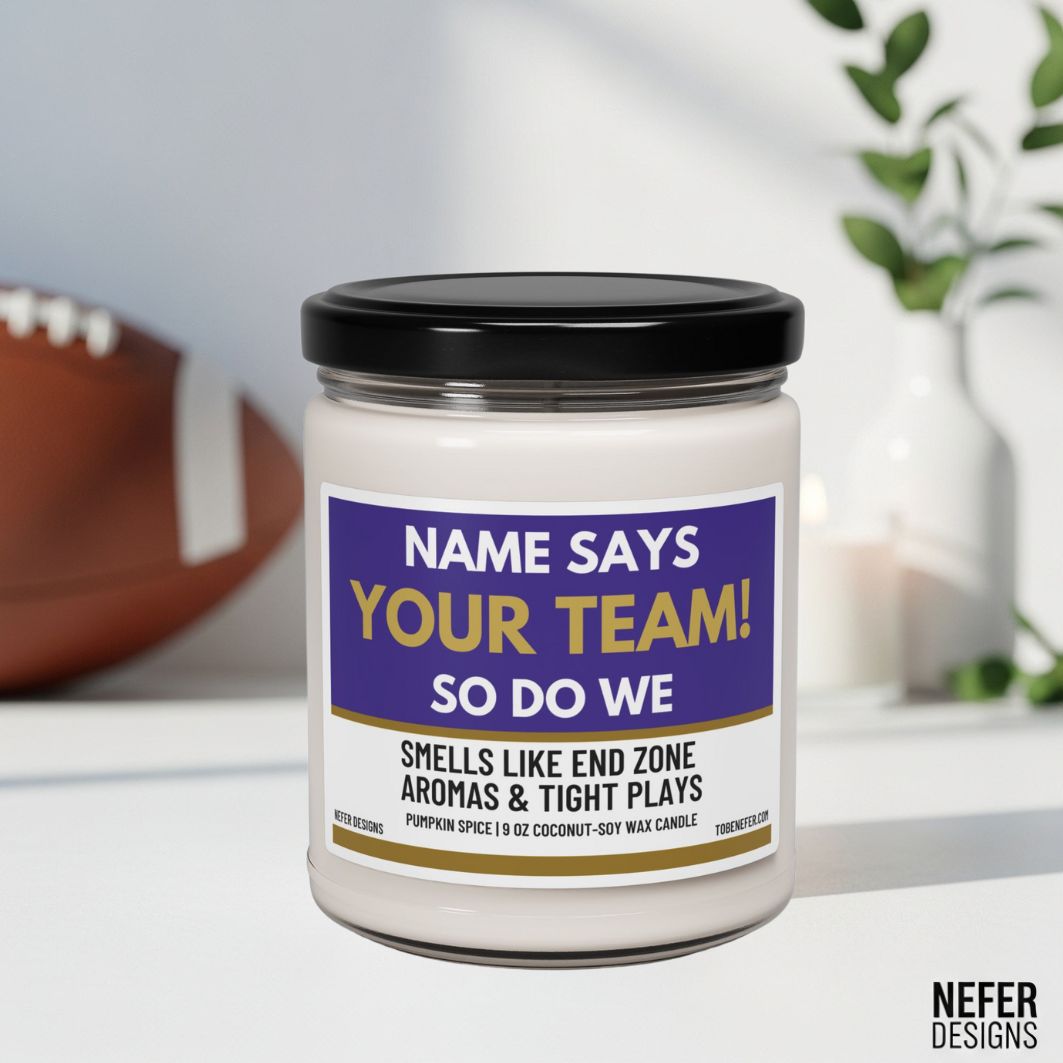 Candle jar with a label indicating team affiliation and scents, placed on a surface with a blurred background.