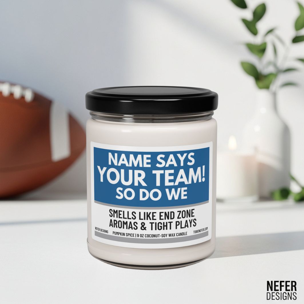 Candle with a humorous label about team spirit and football, placed on a surface with a blurred background.