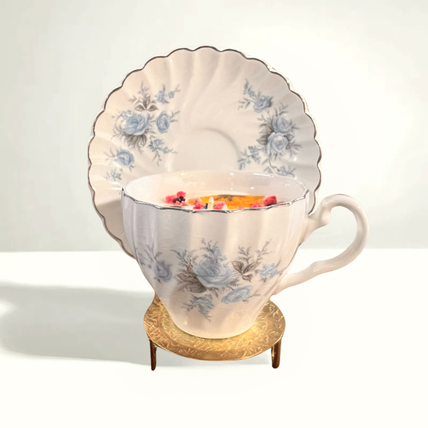 Charming mid-century teacup featuring delicate blue roses, crafted in Staffordshire. A timeless English porcelain collectible.