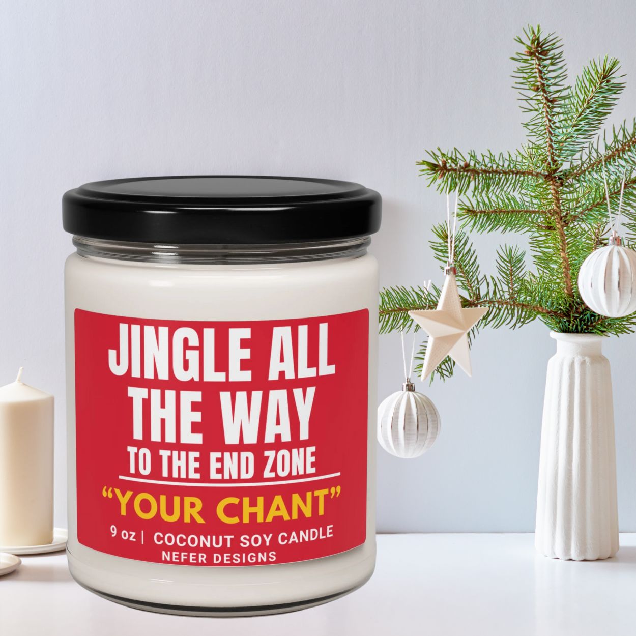 Candle with a red label featuring humorous text, placed on a surface with decorative elements.