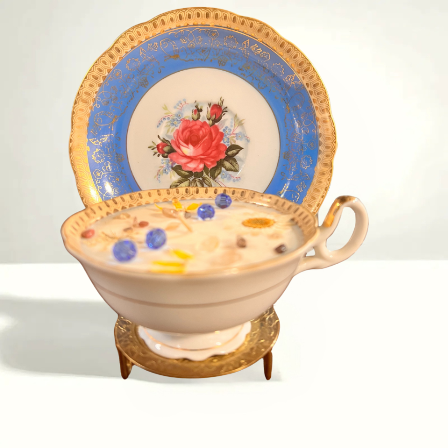 Delicate teacup with pink rose design against a blue backdrop, produced by Royal China Japan in the 1970
