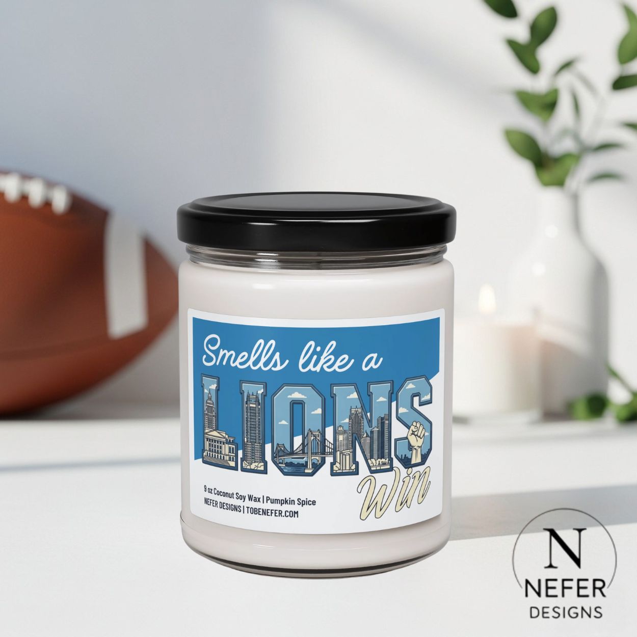 Candle jar with 'Smells like a Lions Win' label on a blurred background