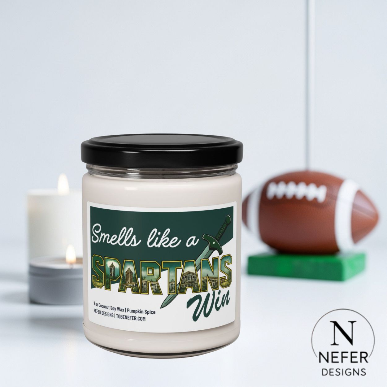 Candle jar with 'Smells like a Spartans Win' label, football in the background