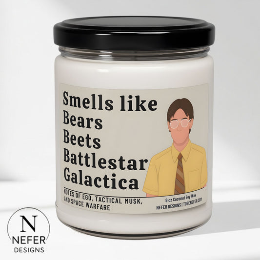 Candle jar with a label featuring text and an illustration of a Dwight from the Office sitcom show on a white background.