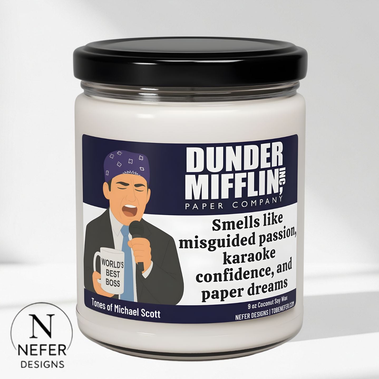 Candle with Dunder Mifflin branding and a humorous description on a white background
